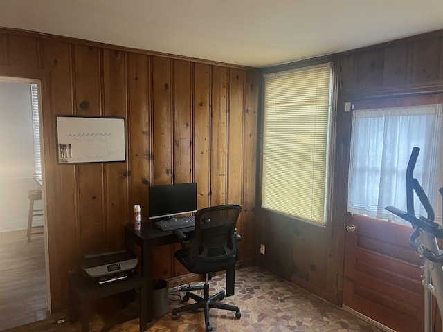 home office featuring wood walls