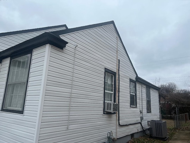 view of side of home featuring cooling unit