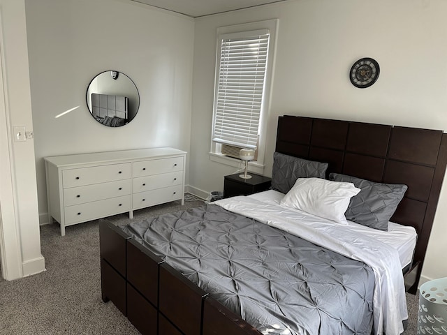 bedroom with dark carpet