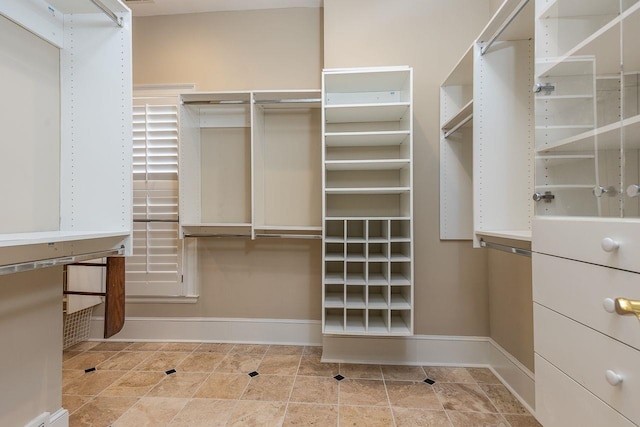 spacious closet featuring tile patterned floors