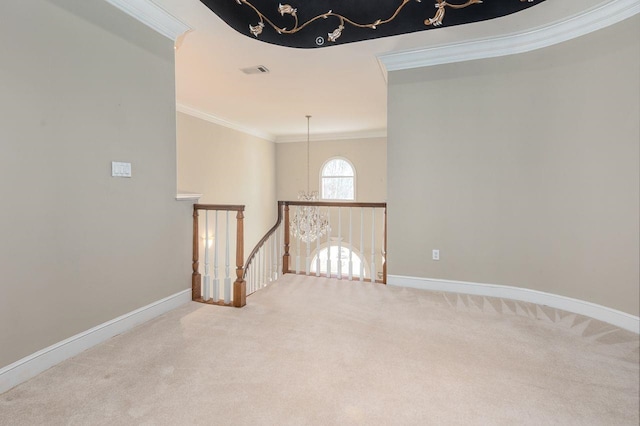 unfurnished room featuring crown molding and carpet floors