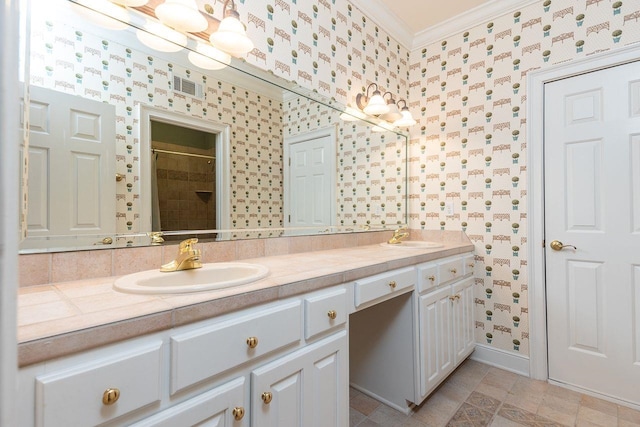 bathroom with walk in shower, vanity, crown molding, and tile patterned flooring