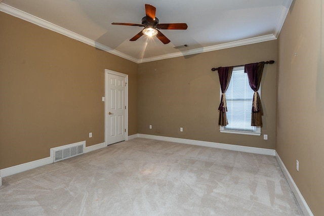 carpeted empty room with ceiling fan and crown molding