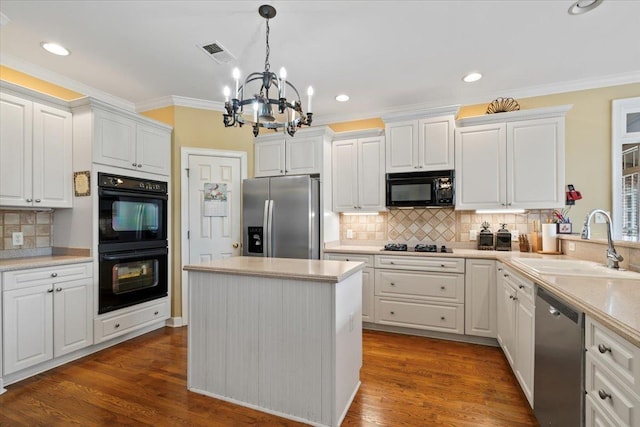 kitchen with black appliances, white cabinets, sink, and an inviting chandelier