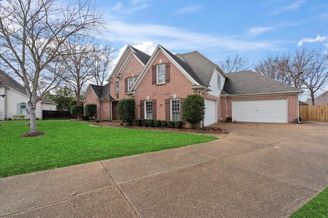 view of property with a front lawn and a garage