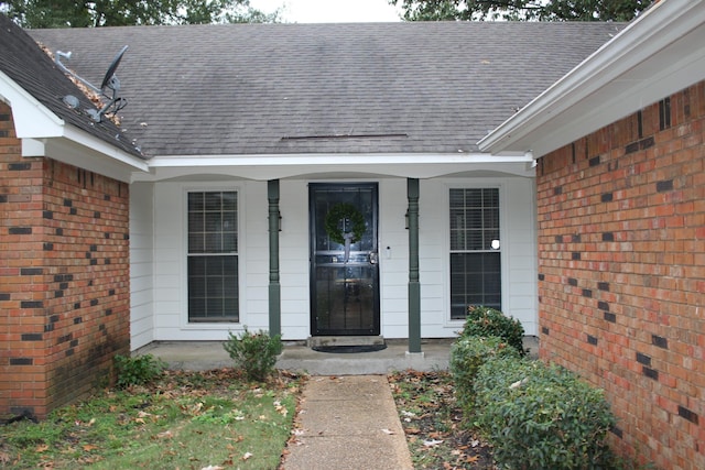 doorway to property with a porch