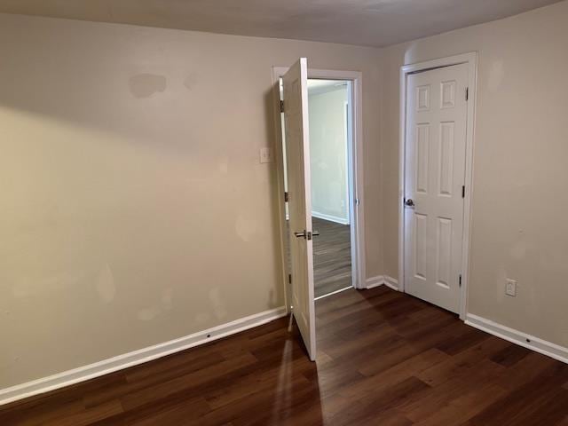 empty room featuring dark hardwood / wood-style floors