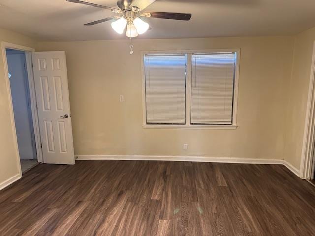 unfurnished room with ceiling fan and dark wood-type flooring