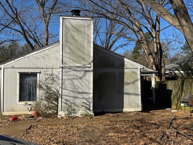 view of property exterior featuring an outbuilding