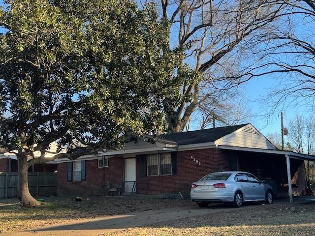 view of front of property with a carport