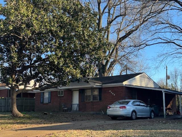 view of front of home featuring a carport