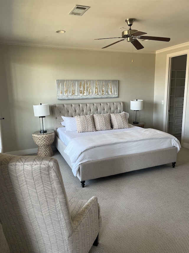 bedroom featuring ceiling fan, ornamental molding, and carpet flooring