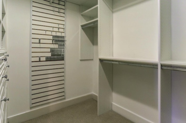 spacious closet with tile patterned floors