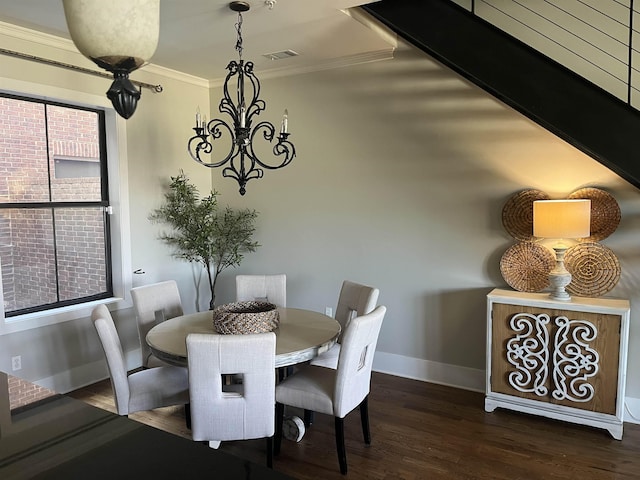 dining room featuring dark hardwood / wood-style floors and crown molding