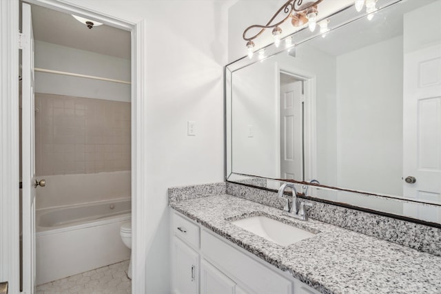 bathroom with toilet, tile patterned flooring, and vanity