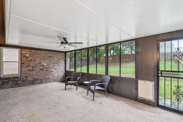 sunroom / solarium with ceiling fan and a healthy amount of sunlight