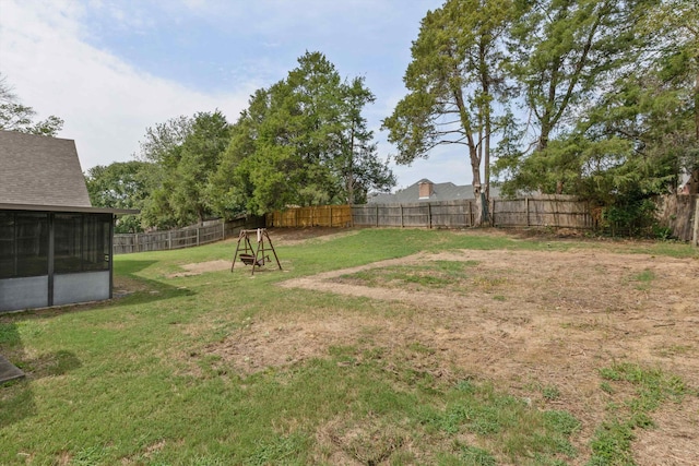 view of yard featuring a sunroom