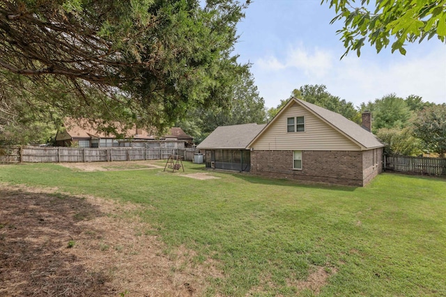 view of yard featuring a sunroom