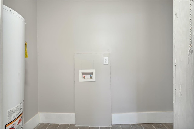 laundry room featuring hookup for a washing machine and water heater