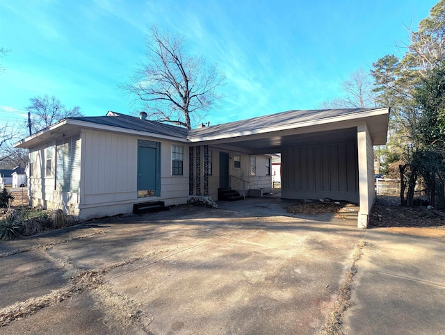 view of front of home featuring a carport