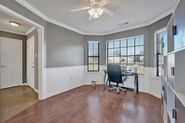 office with ceiling fan, a textured ceiling, hardwood / wood-style flooring, and crown molding