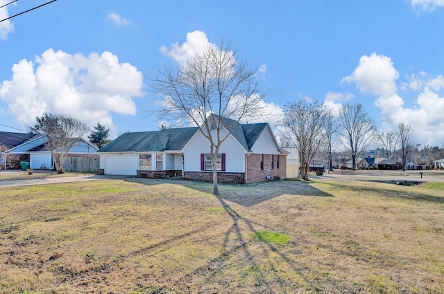 view of front of home featuring a front lawn and a garage