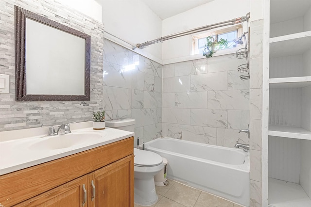 full bathroom featuring tile patterned floors, vanity, tile walls, toilet, and bathtub / shower combination