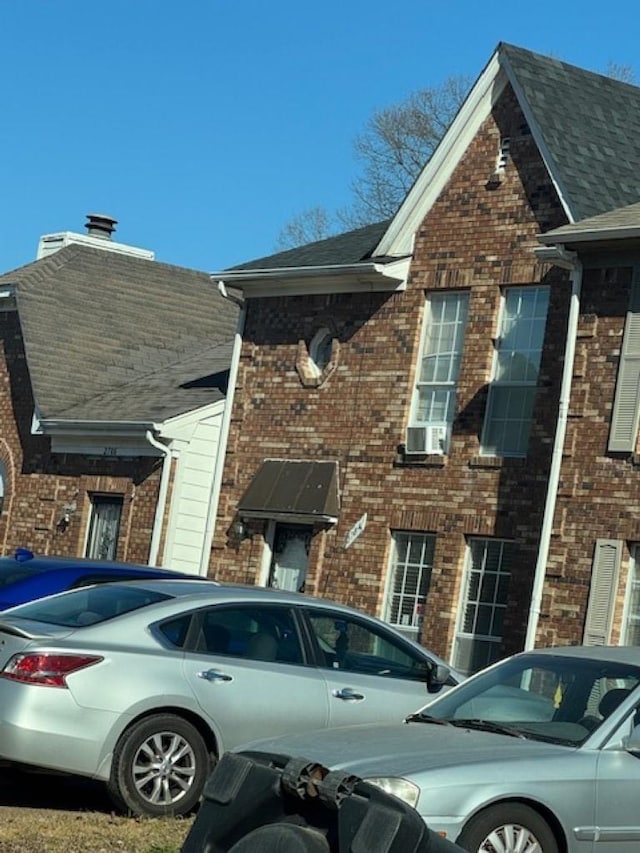 view of side of property featuring cooling unit