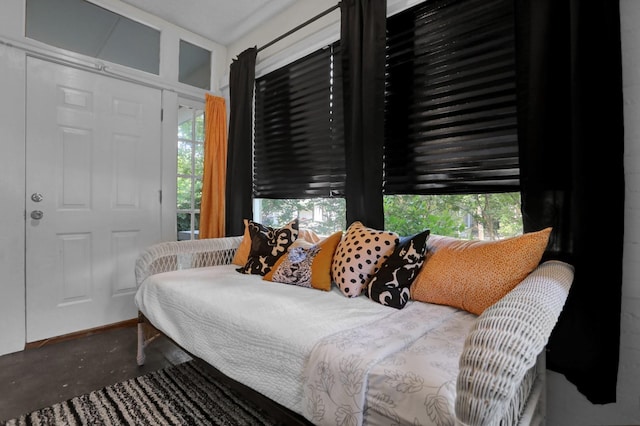 bedroom featuring a closet and concrete flooring