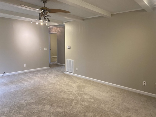 carpeted spare room with ceiling fan and beam ceiling