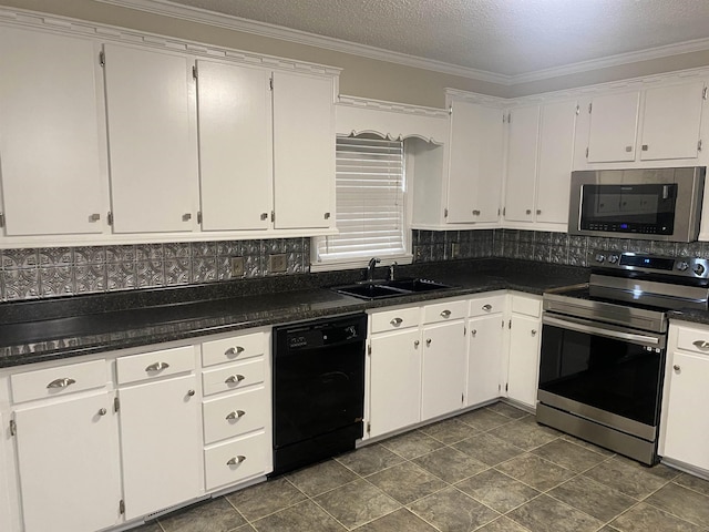 kitchen featuring a textured ceiling, white cabinetry, stainless steel appliances, tasteful backsplash, and sink