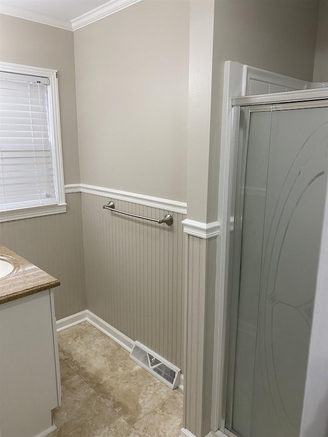 bathroom featuring vanity and ornamental molding