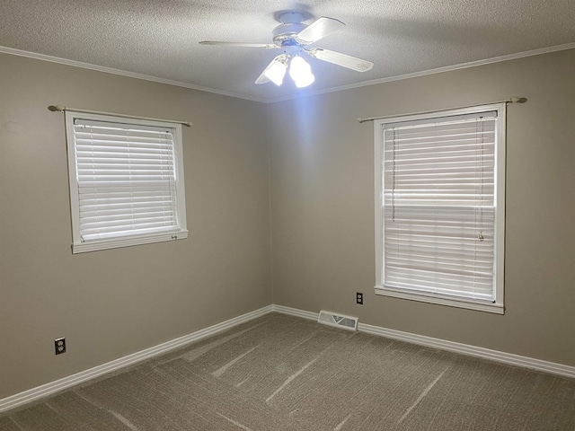 unfurnished room with a textured ceiling, ornamental molding, and carpet flooring