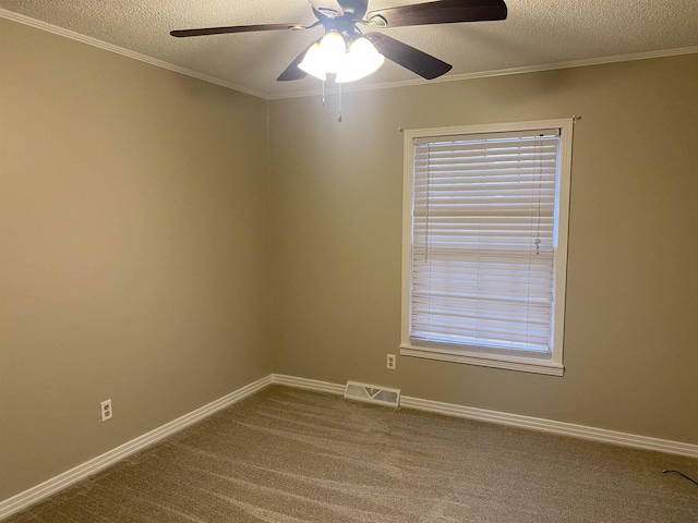 unfurnished room with ceiling fan, carpet, crown molding, and a textured ceiling