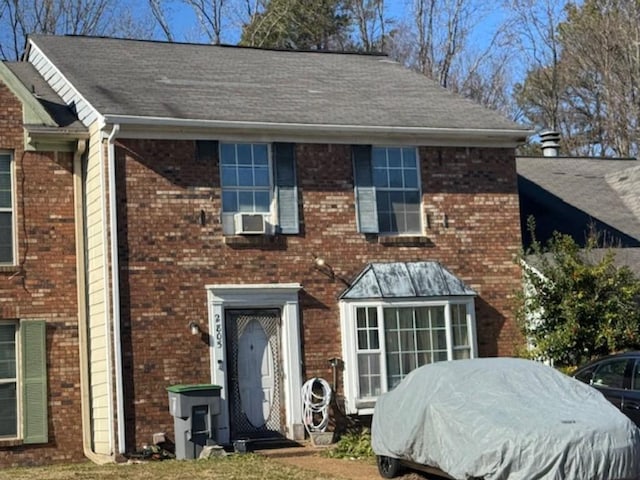 view of front facade featuring cooling unit