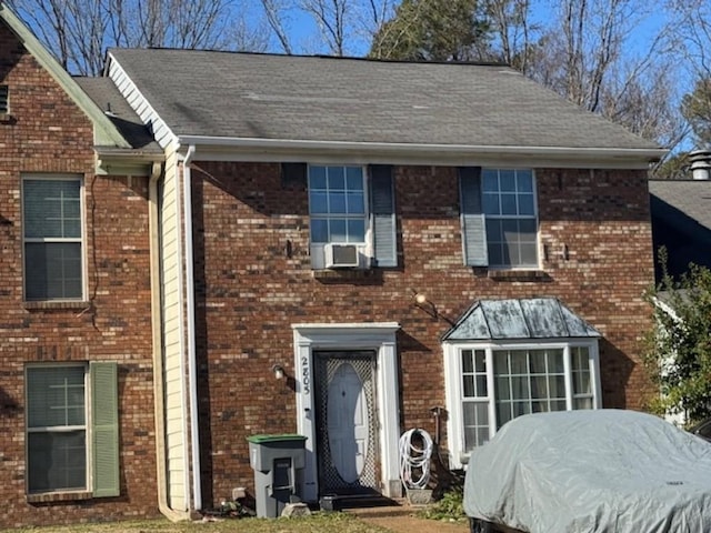 view of front facade featuring cooling unit