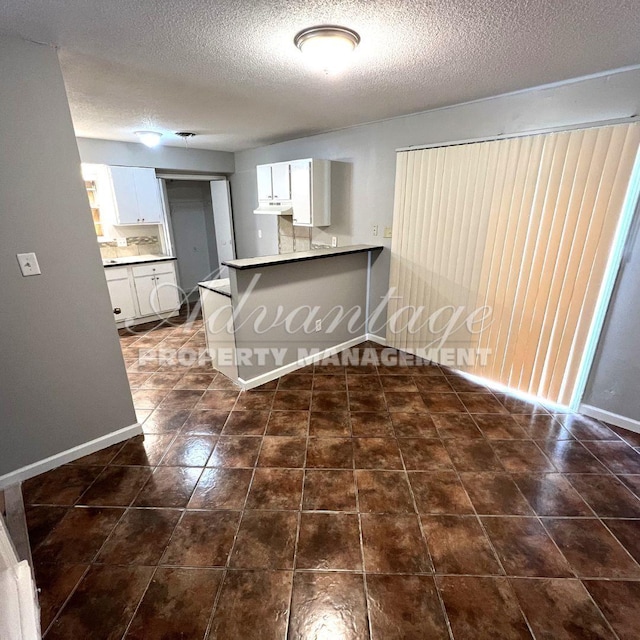 interior space featuring a textured ceiling