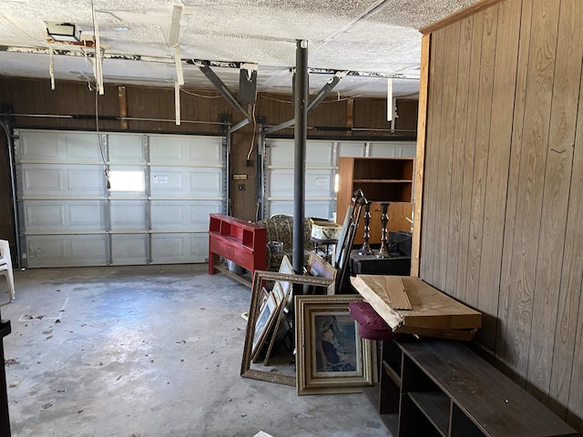 garage featuring wooden walls