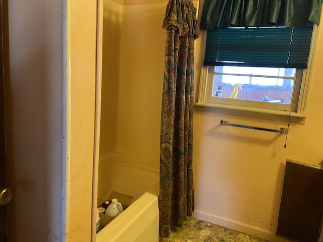 bathroom featuring shower / bathtub combination with curtain