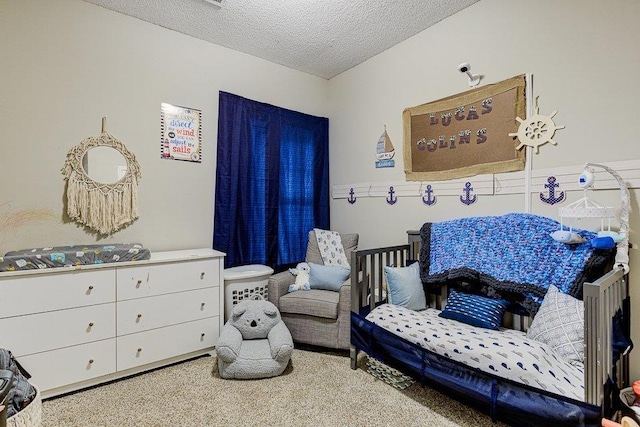 carpeted bedroom featuring a textured ceiling