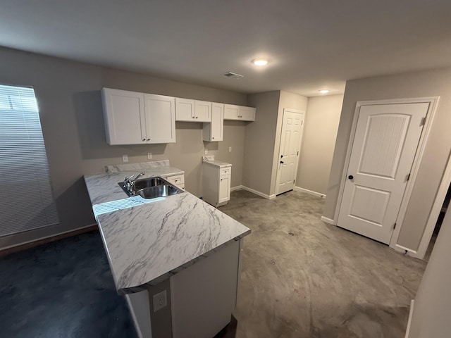 kitchen with sink and white cabinets