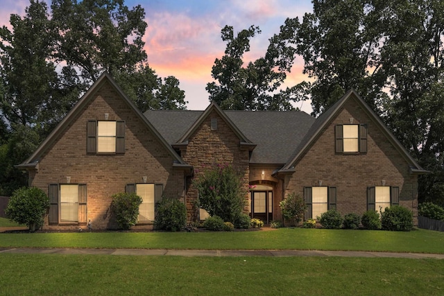 front facade with a yard