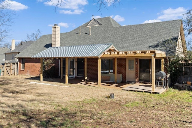 back of house with a lawn