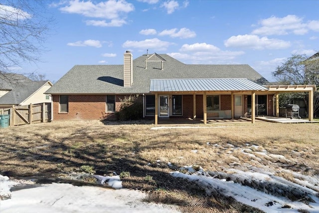 rear view of property featuring a patio area