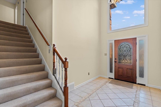 foyer entrance with light tile patterned floors