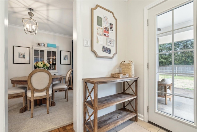 dining room featuring crown molding and a chandelier