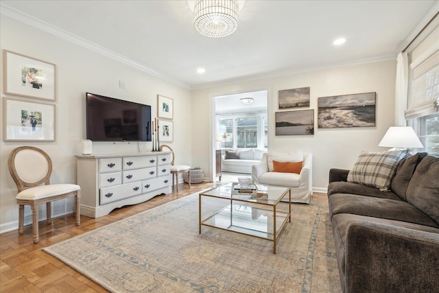 living room with light parquet flooring, ornamental molding, and a chandelier