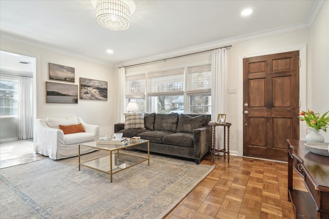 living room with ornamental molding and parquet floors