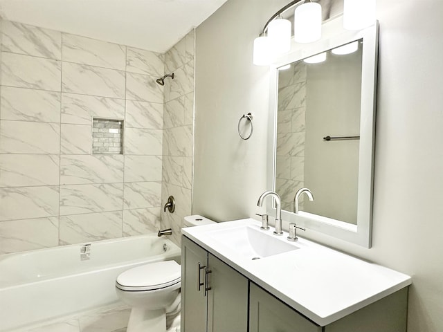 full bathroom with toilet, tiled shower / bath combo, and vanity