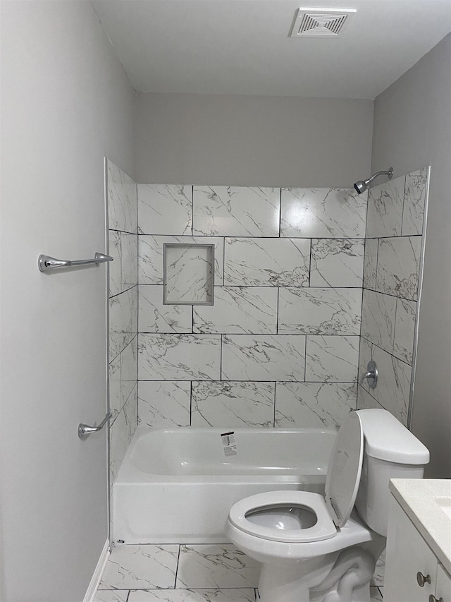 full bathroom featuring toilet, vanity, and tiled shower / bath combo